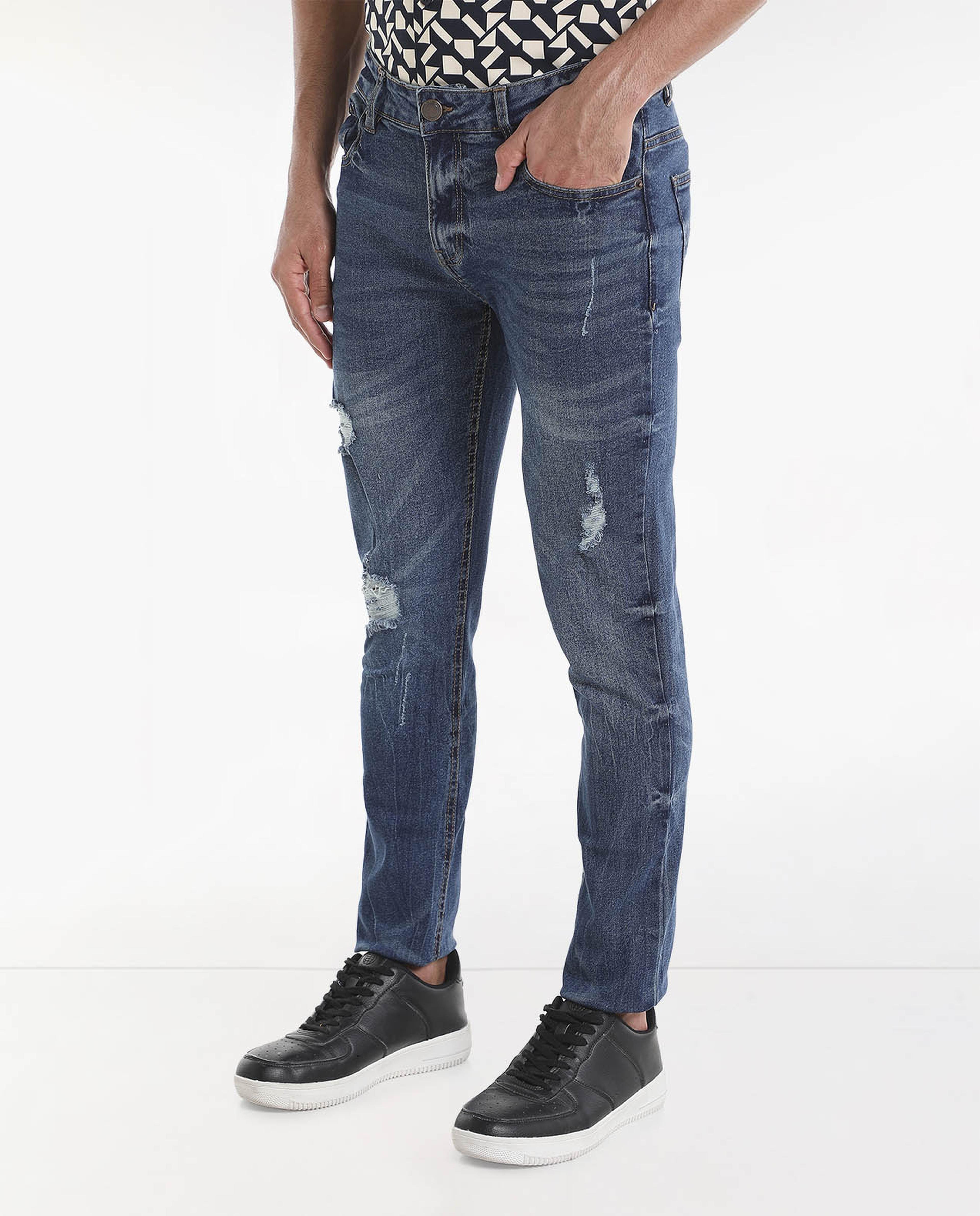 Light Faded Mildly Distressed Mid-Rise Jeans with Button Closure