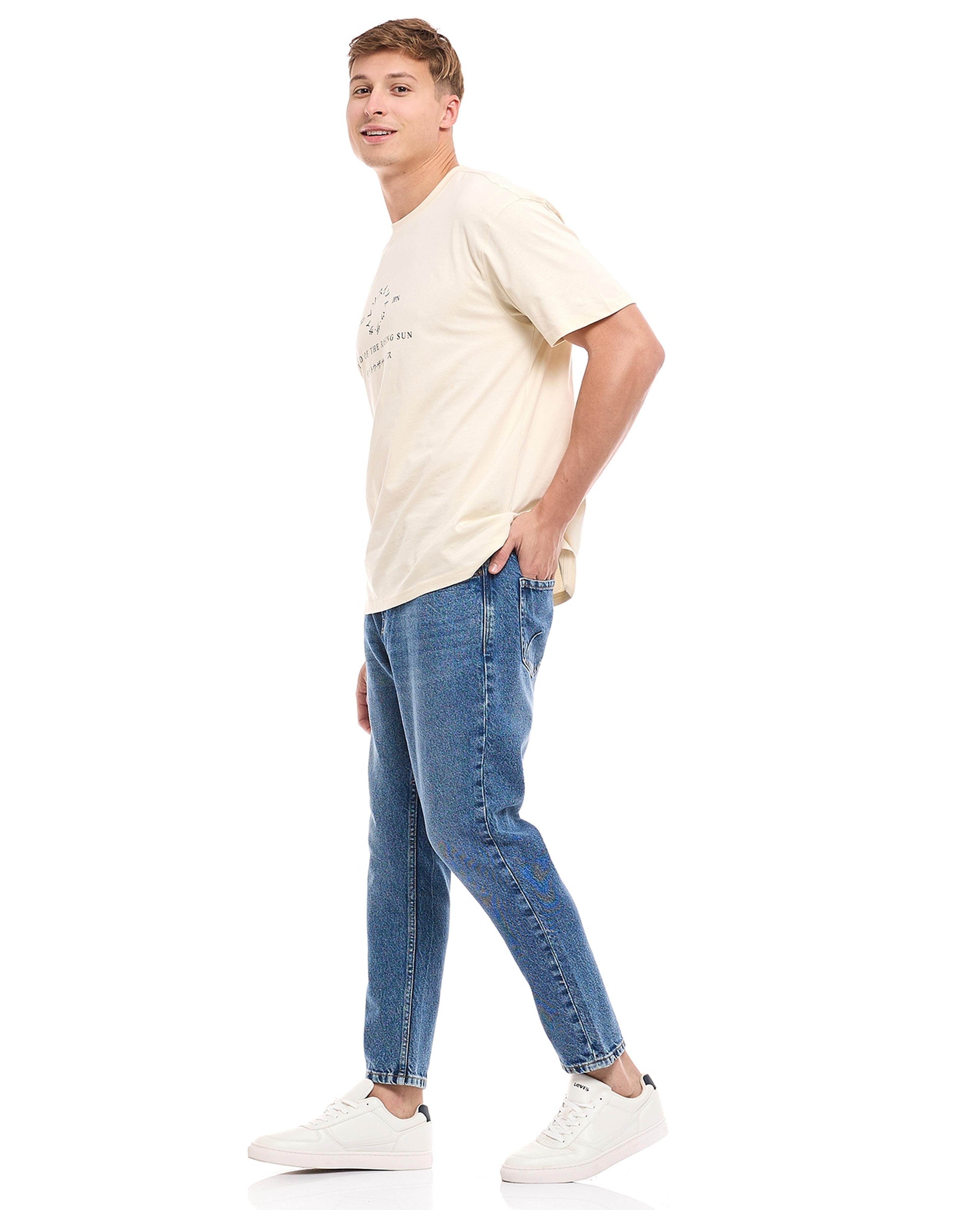 Faded Tapered Jeans with Button Closure